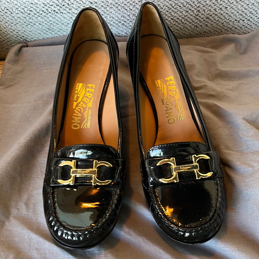 Ferragamo Black Patent Leather Pumps. Gold hardware